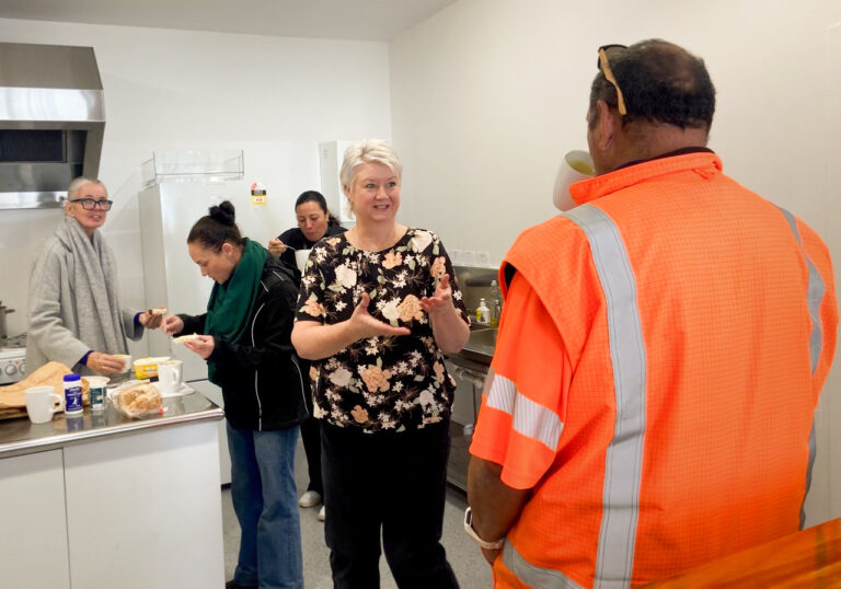Arwen Flowers welcomes a visitor to the first Community Soup Chat day